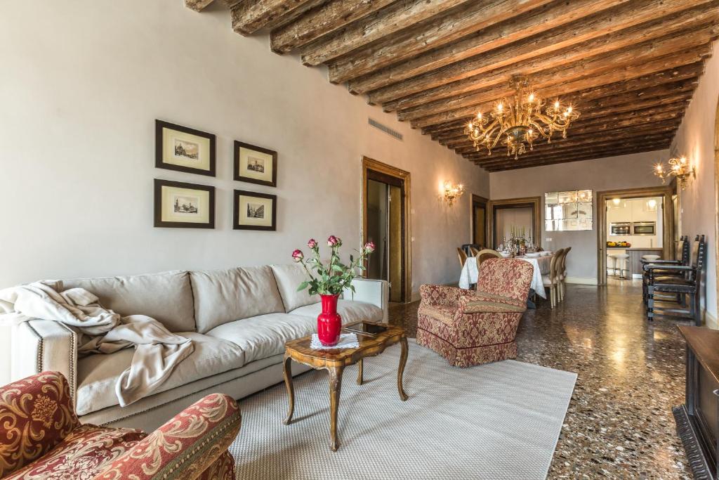 a living room with a couch and a table at Palazzina Canal in Venice