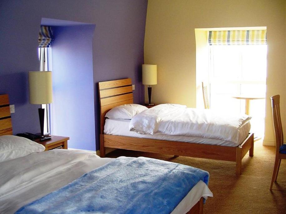 Postel nebo postele na pokoji v ubytování Pier Head Hotel Spa & Leisure