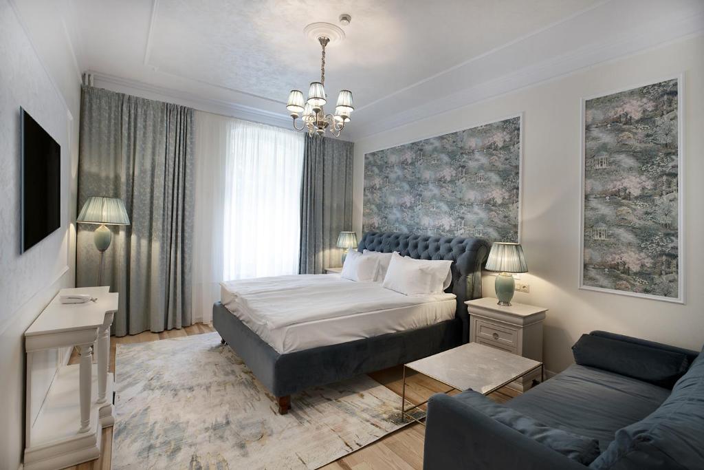 Postel nebo postele na pokoji v ubytování Hotel Caraiman