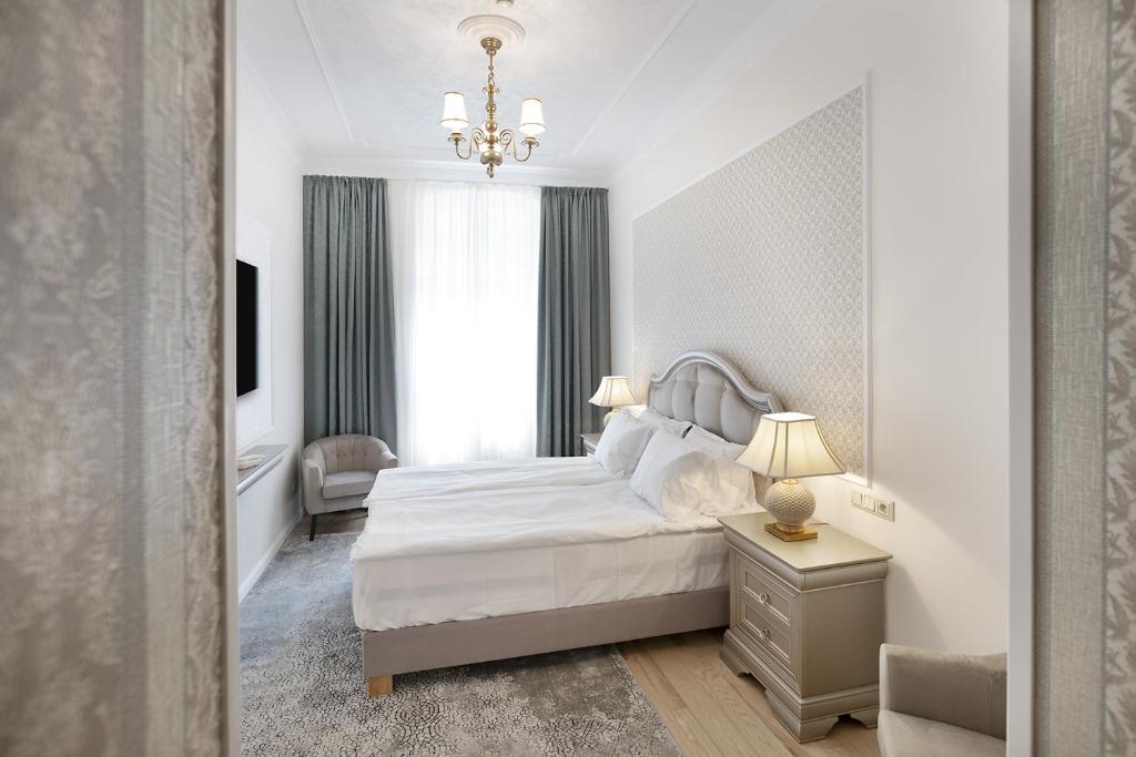 Postel nebo postele na pokoji v ubytování Hotel Caraiman