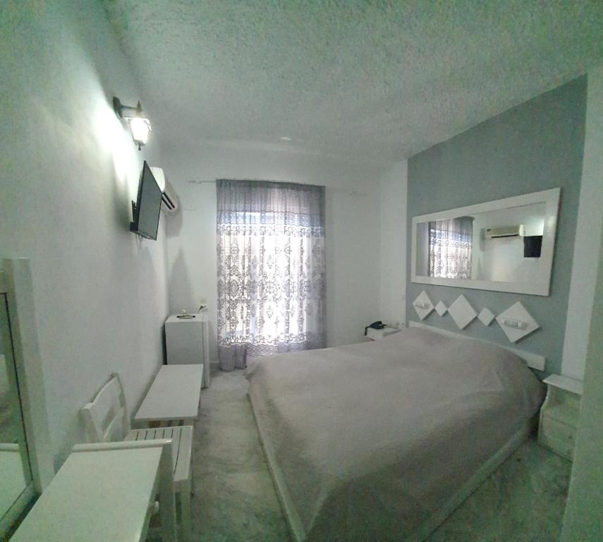 Uma cama ou camas num quarto em Porto Castello