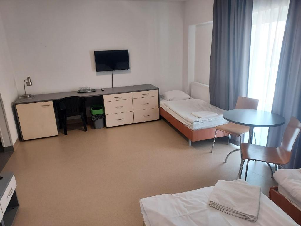 Posteľ alebo postele v izbe v ubytovaní WOSiR Drzonków