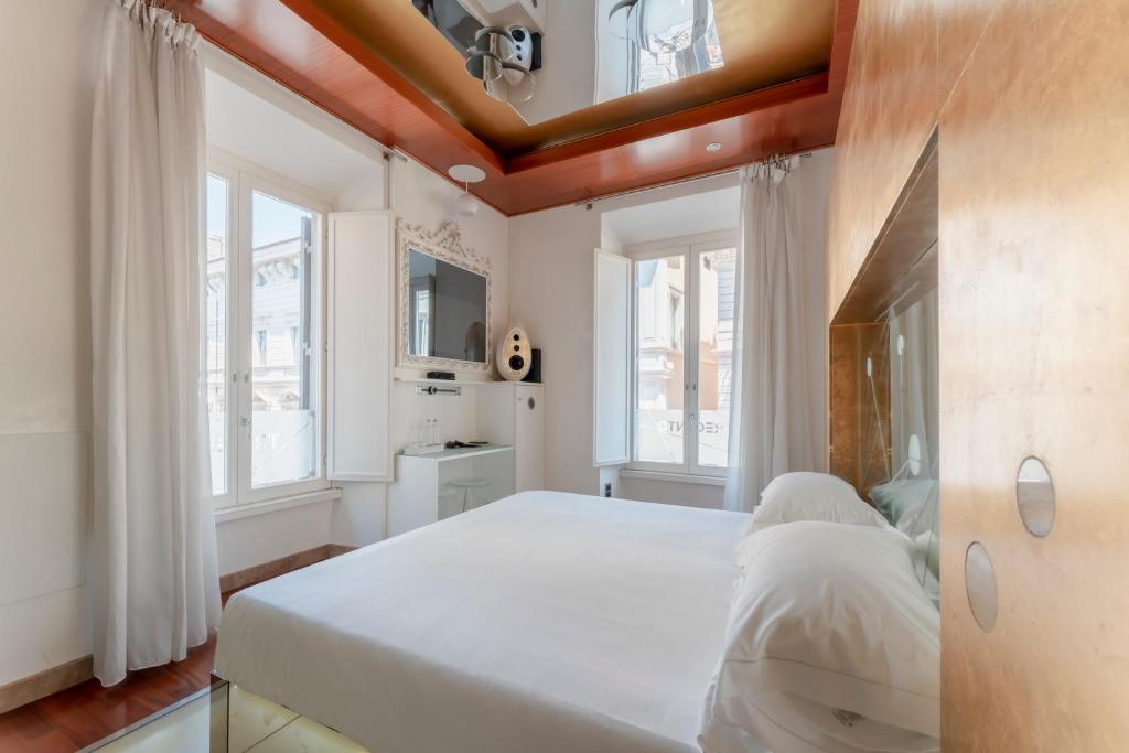 Een bed of bedden in een kamer bij Hotel Trecento
