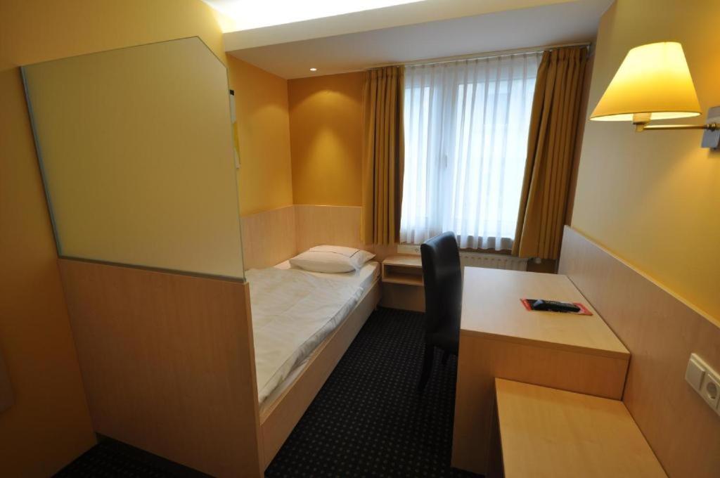 Rúm í herbergi á Hotel Empire
