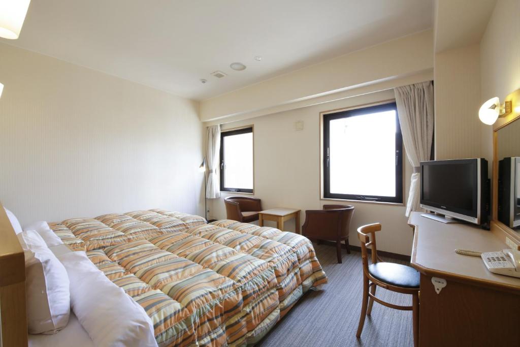 TV a/nebo společenská místnost v ubytování Nagoya B's Hotel