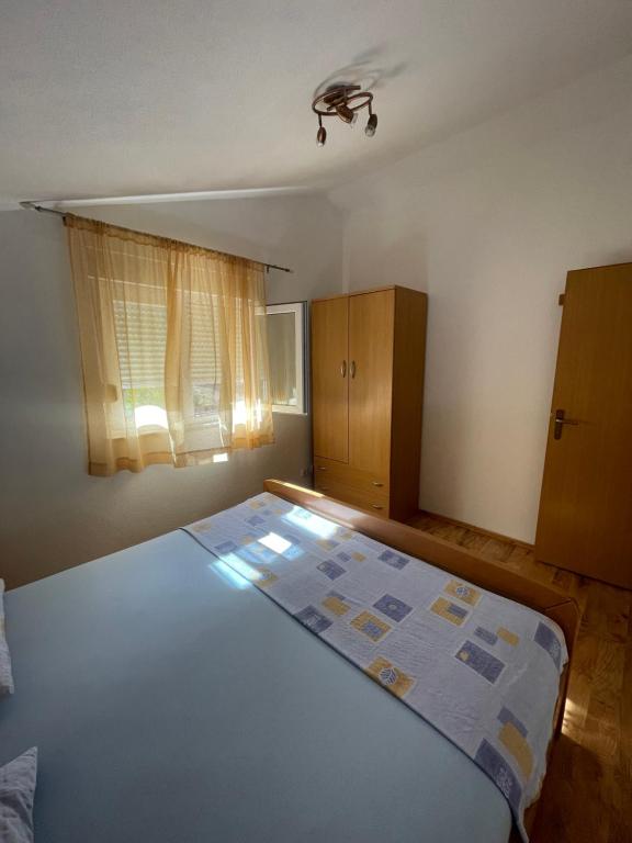 Postel nebo postele na pokoji v ubytování Apartman Jukic