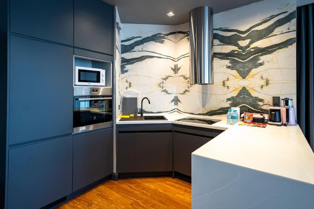 a kitchen with a sink and a counter top at Superior, classy residence,7&#47;24 Security,2 bedroom ( Benesta 205 ) in Istanbul