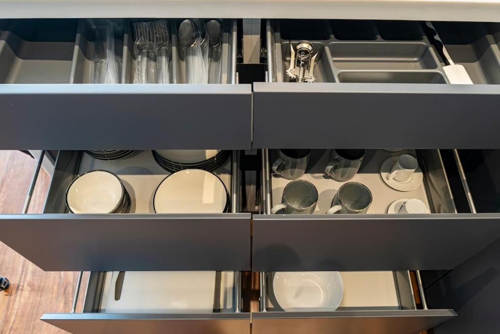 an open kitchen drawer with dishes and utensils at Superior, classy residence,7&#47;24 Security,2 bedroom ( Benesta 205 ) in Istanbul