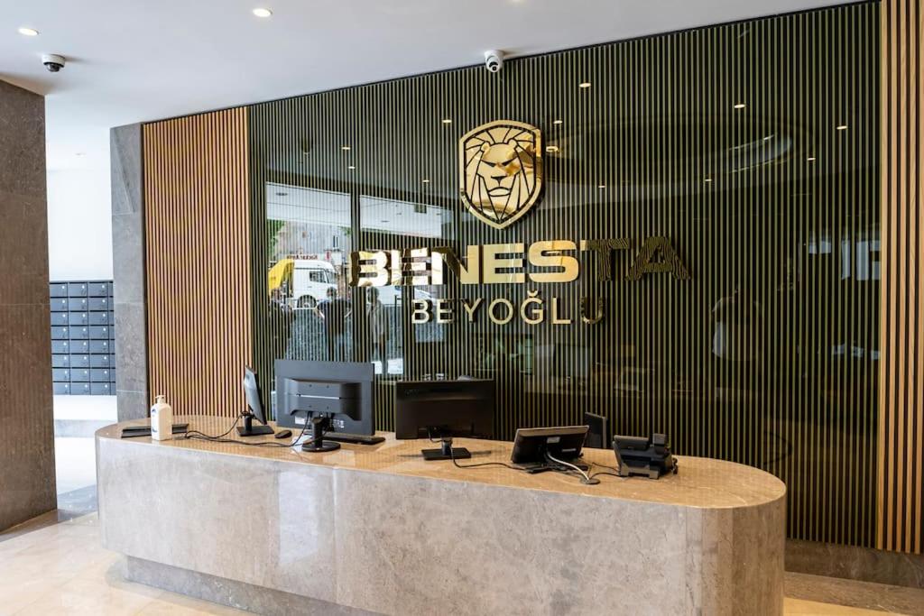 a lobby with a reception desk with a lion on the wall at Superior, classy residence,7&#47;24 Security,2 bedroom ( Benesta 205 ) in Istanbul