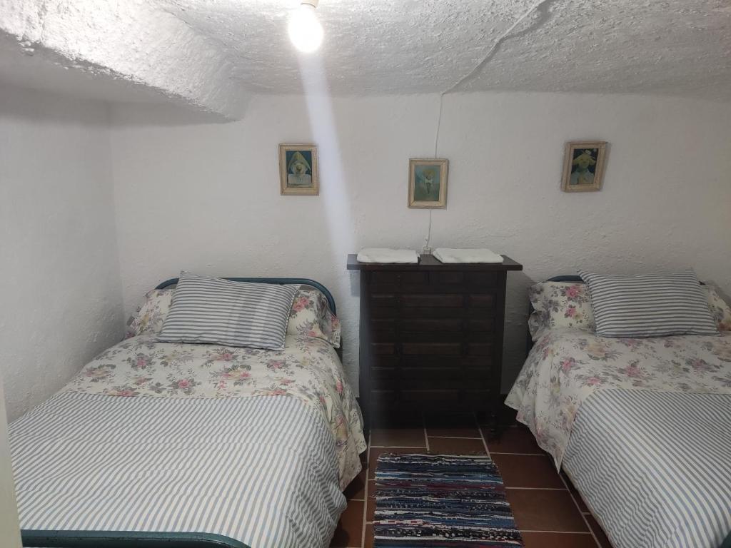 Postel nebo postele na pokoji v ubytování Cueva Navarro