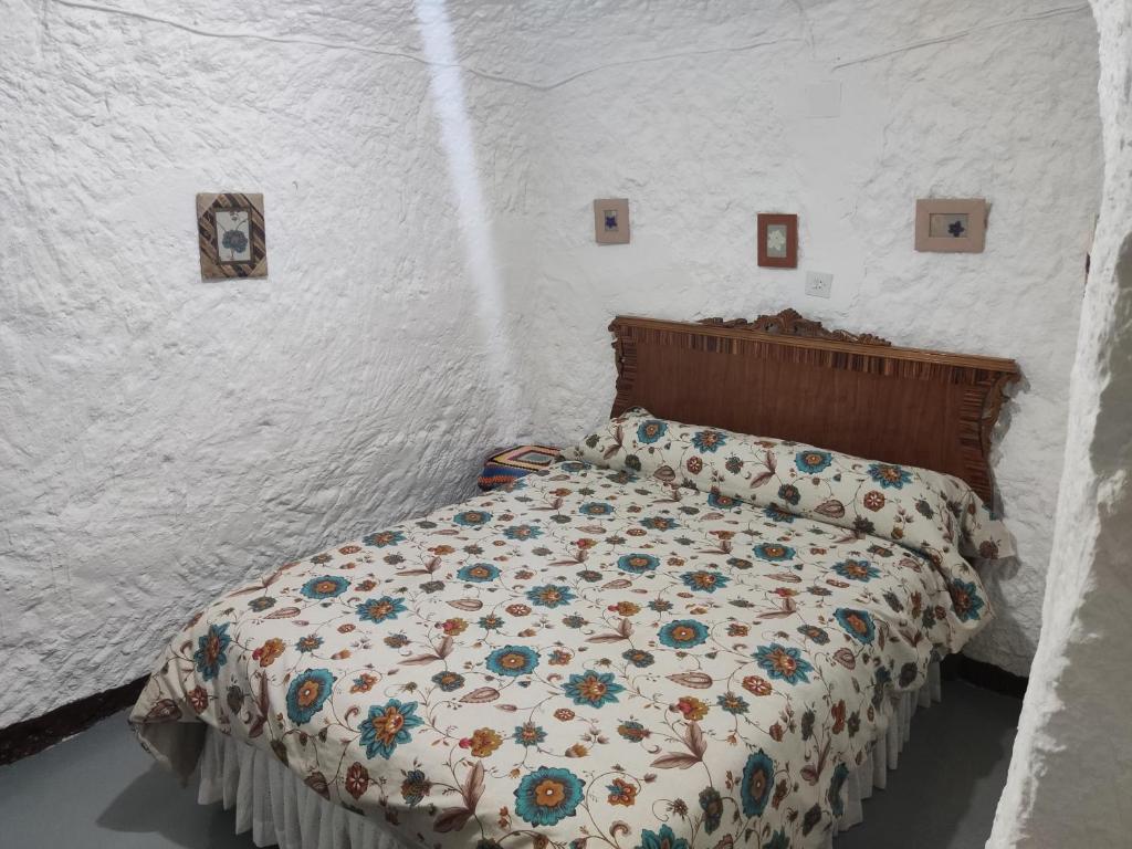 Postel nebo postele na pokoji v ubytování Cueva Navarro