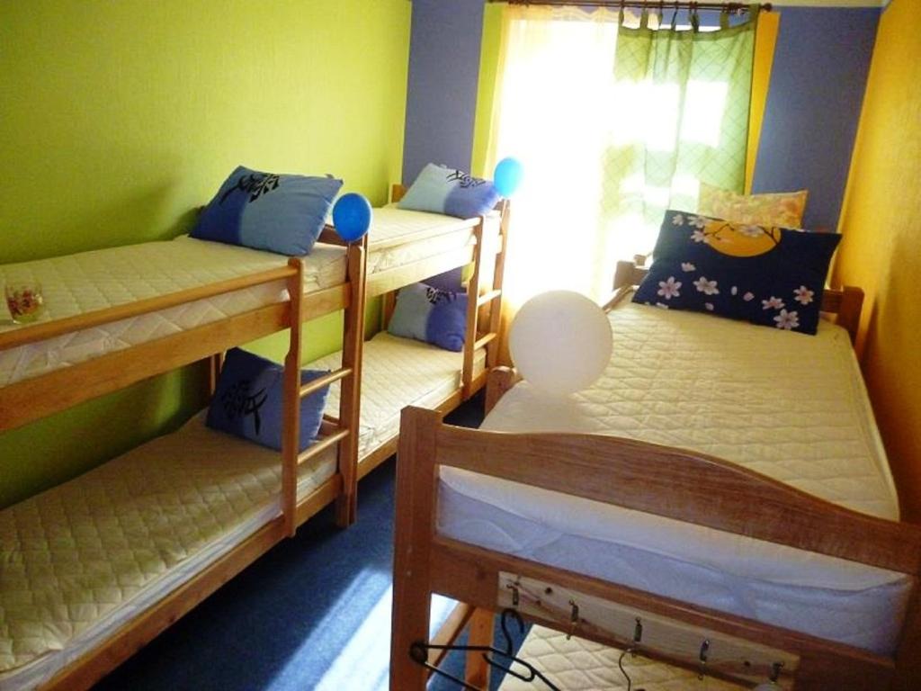 Postel nebo postele na pokoji v ubytování YourHostel Club
