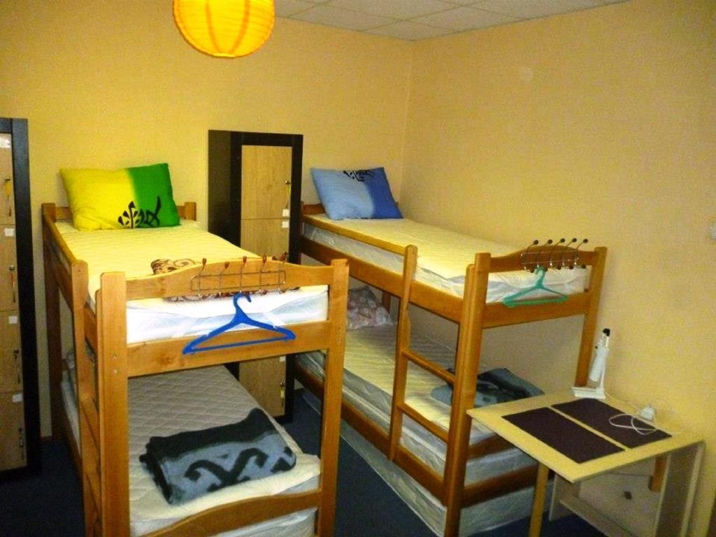 Postel nebo postele na pokoji v ubytování YourHostel Club