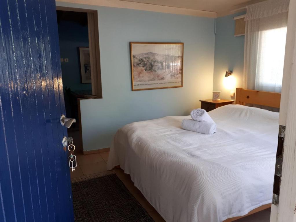 a bedroom with a bed with a towel on it at Eretz Hagalil - Land of Galilee in Amirim