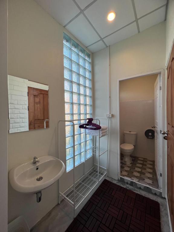 Koupelna v ubytování Naisang Hostel