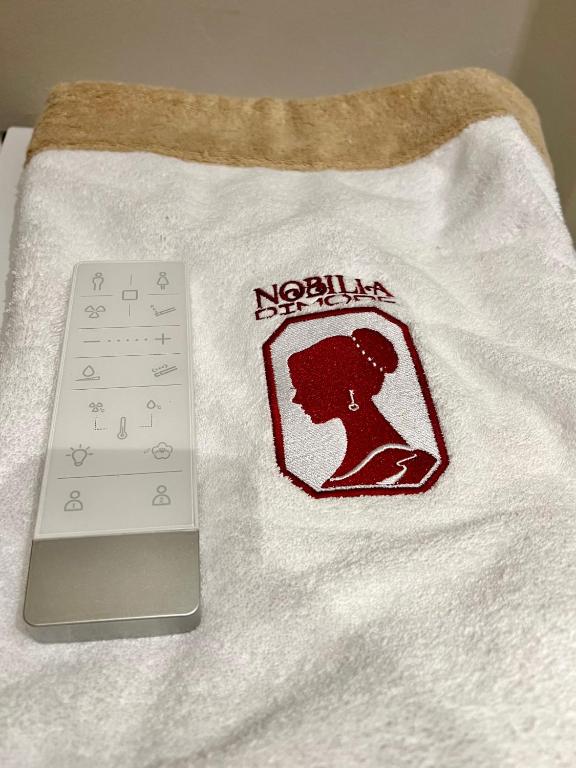 Postel nebo postele na pokoji v ubytování Nobilia Dimore - Suite & Spa®