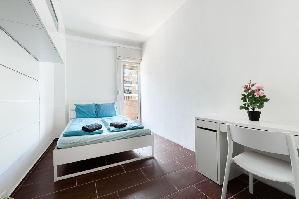 a small bedroom with a bed and a desk at Downtown Buda Homes Relax in Budapest