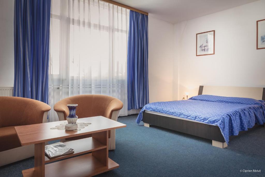 Postel nebo postele na pokoji v ubytování Hotel Iris
