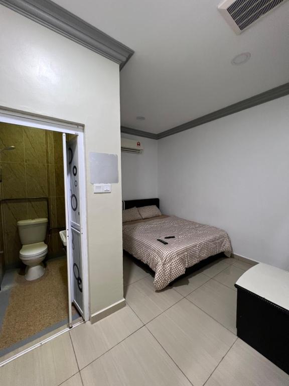 Postel nebo postele na pokoji v ubytování Ourstay Nadi Kota