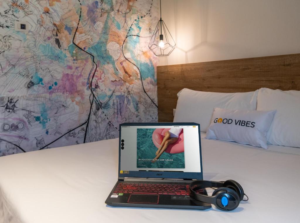 Postel nebo postele na pokoji v ubytování Catignano Hotel