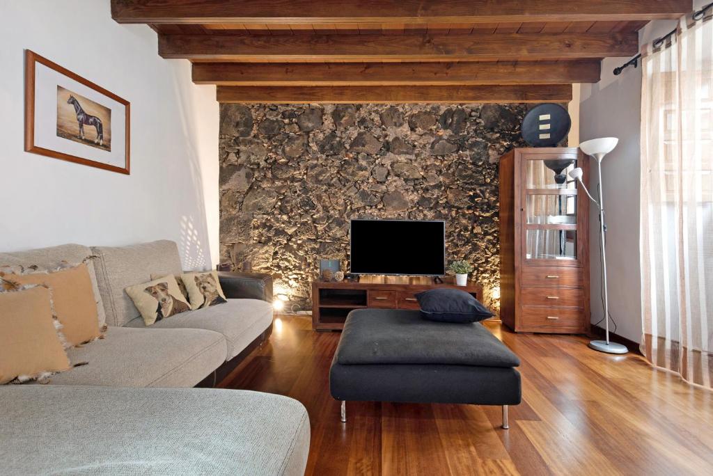 Televízia a/alebo spoločenská miestnosť v ubytovaní Casa Gauguin