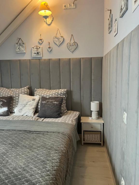 Giường trong phòng chung tại Comfort Zone Ostróda Apartment 1