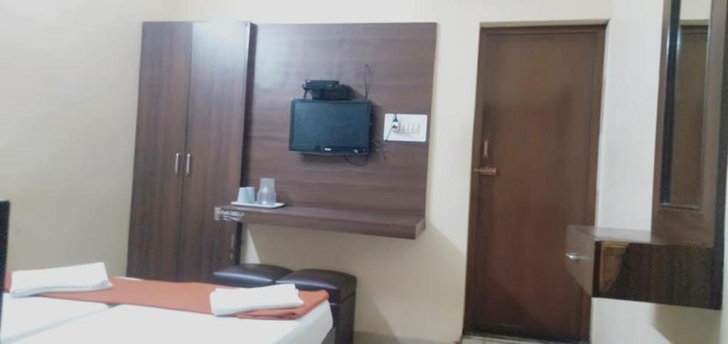 Postel nebo postele na pokoji v ubytování PLAZA GUEST HOUSE