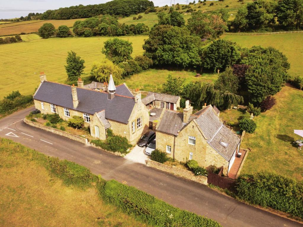 an aerial view of a large house in a field at Coxgreen Old Schoolhouse in Sunderland