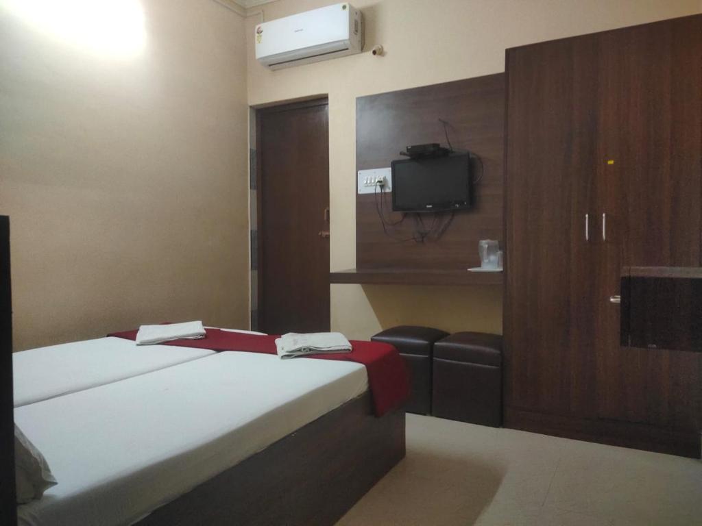 Postel nebo postele na pokoji v ubytování PLAZA GUEST HOUSE