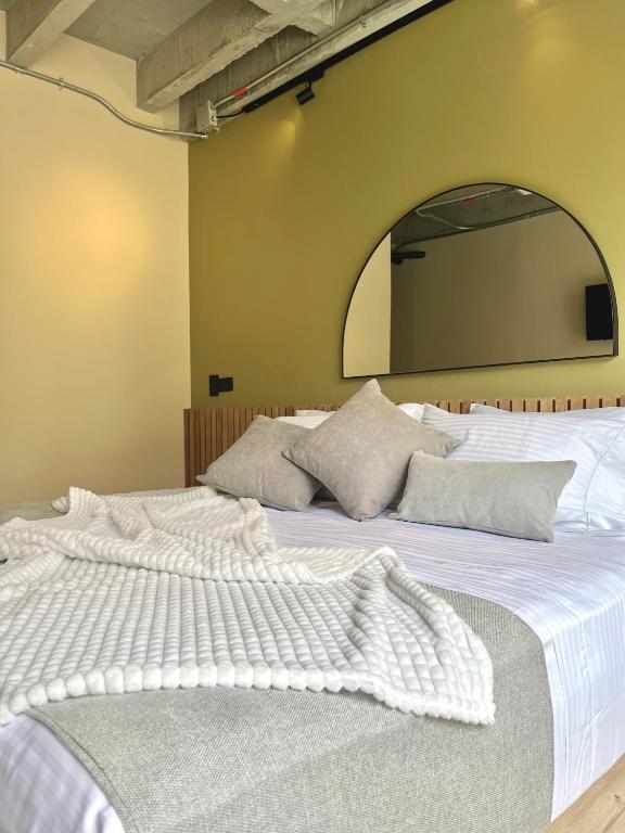 Postel nebo postele na pokoji v ubytování beminimal Hotel