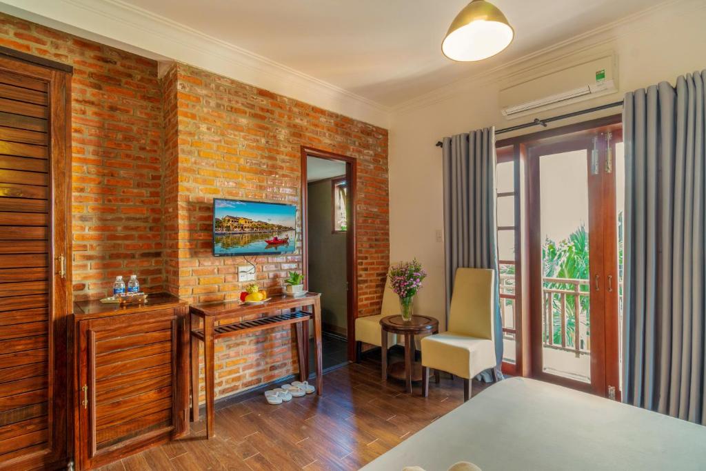Llit o llits en una habitació de Calm House Hotel Hoi An 1