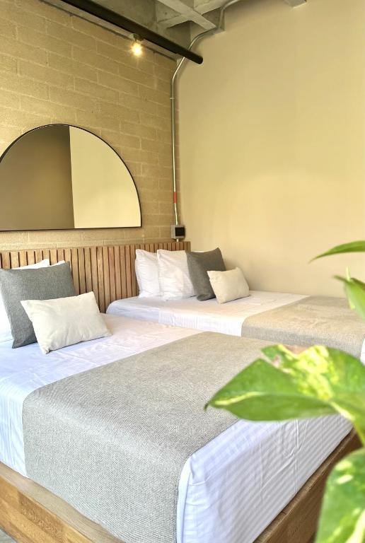 Postel nebo postele na pokoji v ubytování beminimal Hotel