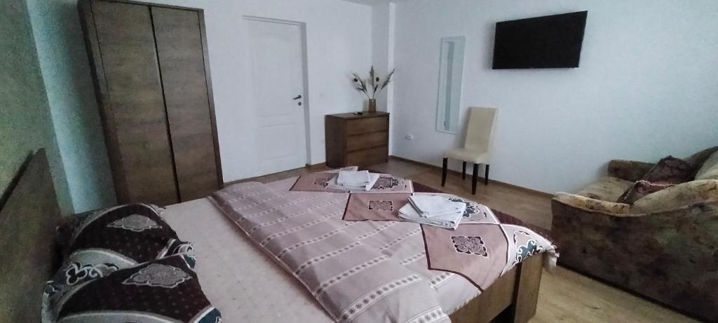 Postel nebo postele na pokoji v ubytování Casa Luminița