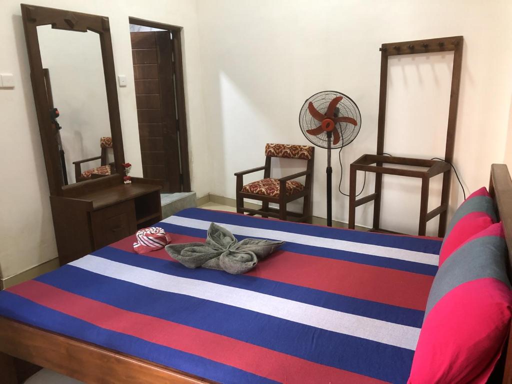 Postel nebo postele na pokoji v ubytování Hotel Varsha