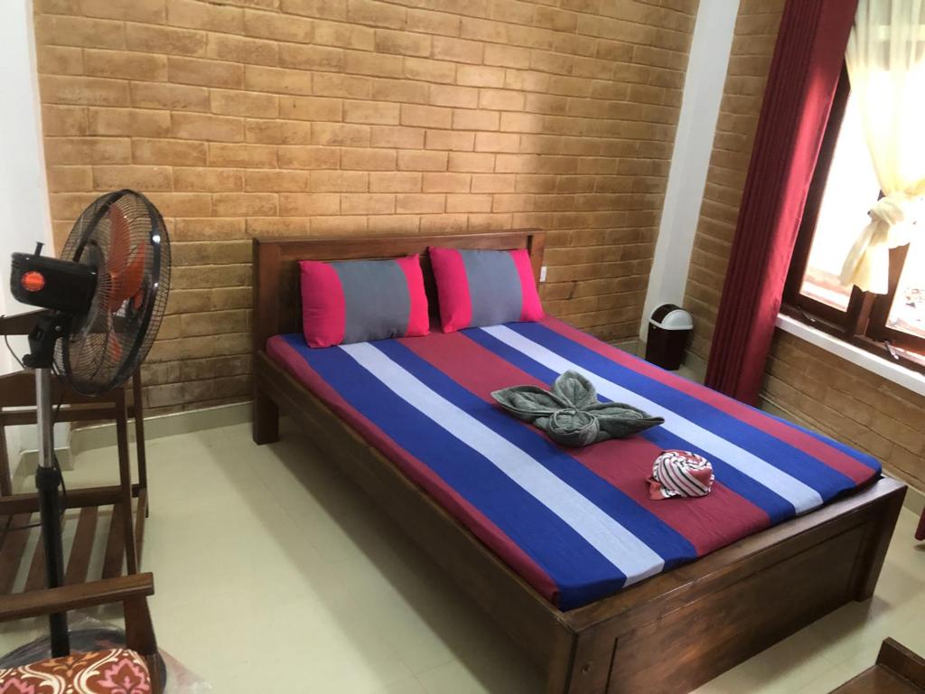 Postel nebo postele na pokoji v ubytování Hotel Varsha