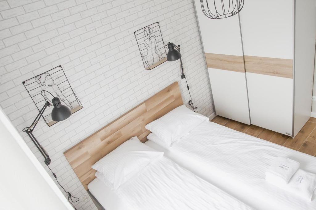 Postel nebo postele na pokoji v ubytování AL-DOM Apartamenty Summer 4