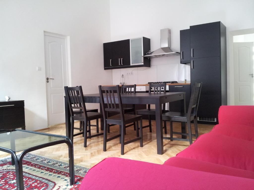 a kitchen and dining room with a table and chairs at Anna 2 bedrooms 2 bathrooms 6 bikes in Budapest