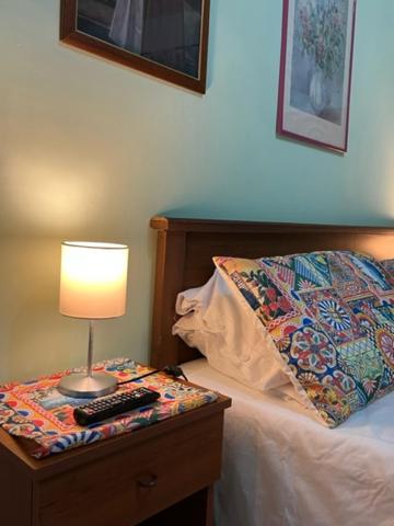 Postel nebo postele na pokoji v ubytování Holiday Gole Alcantara Graniti Room