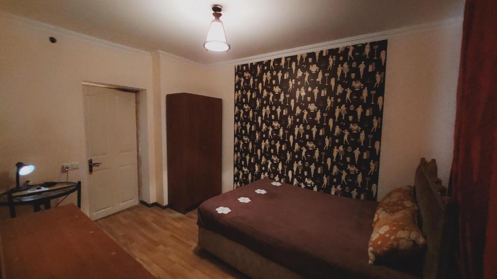 Postel nebo postele na pokoji v ubytování Buddha apartment