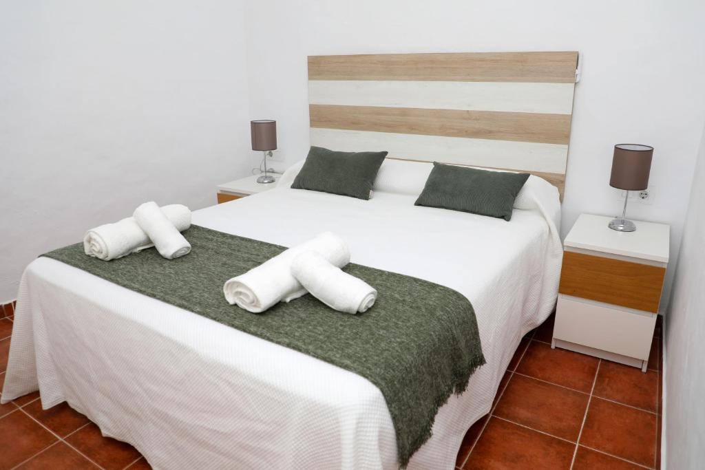 Łóżko lub łóżka w pokoju w obiekcie Casa La Herradura 1