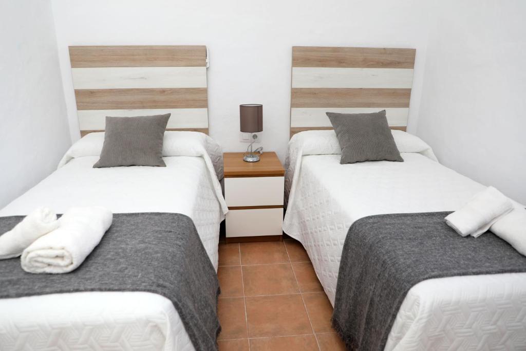 Łóżko lub łóżka w pokoju w obiekcie Casa La Herradura 1