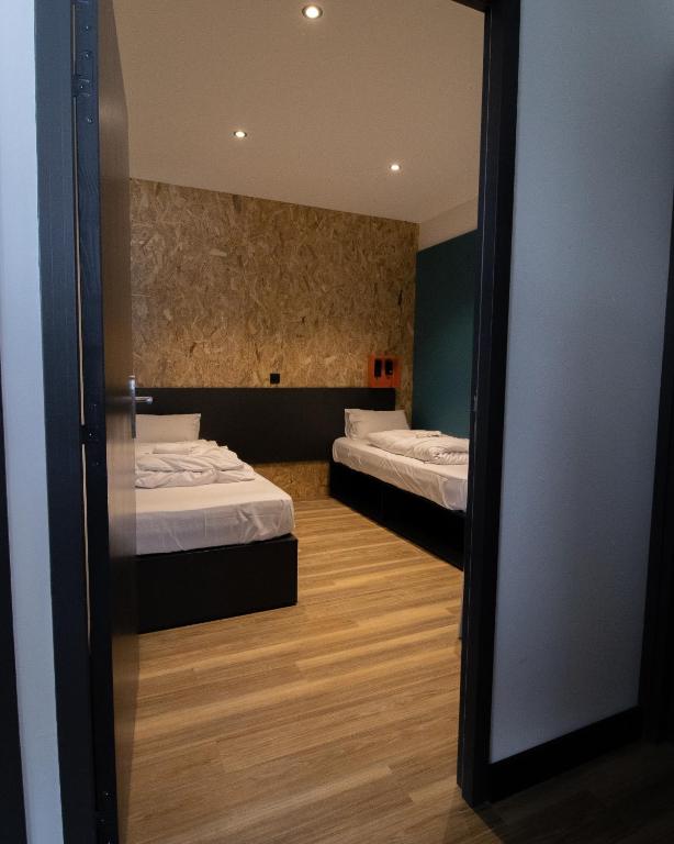 Postel nebo postele na pokoji v ubytování Moontain Hostel