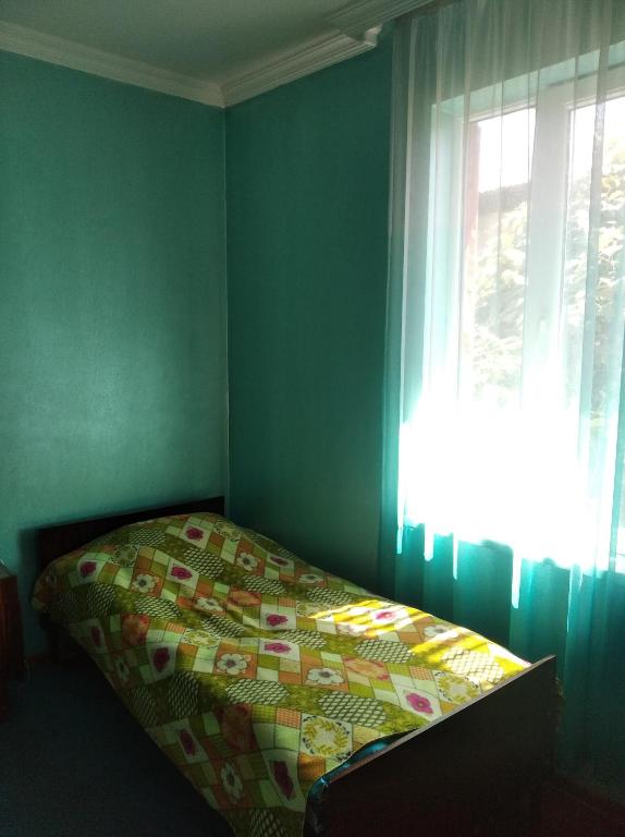 Postel nebo postele na pokoji v ubytování Roin Guest House