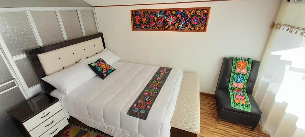 Postel nebo postele na pokoji v ubytování Uros Amaru Marka Lodge