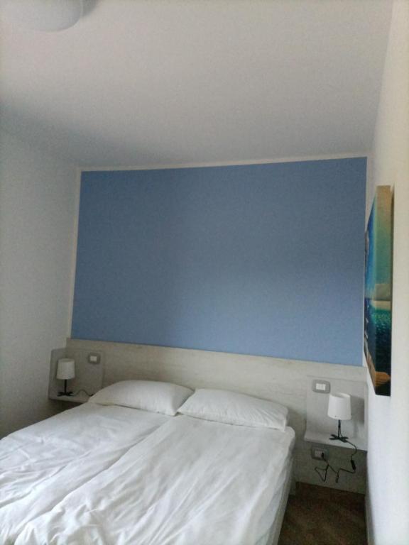 Postel nebo postele na pokoji v ubytování B&B Rio Rai Alpe Adria