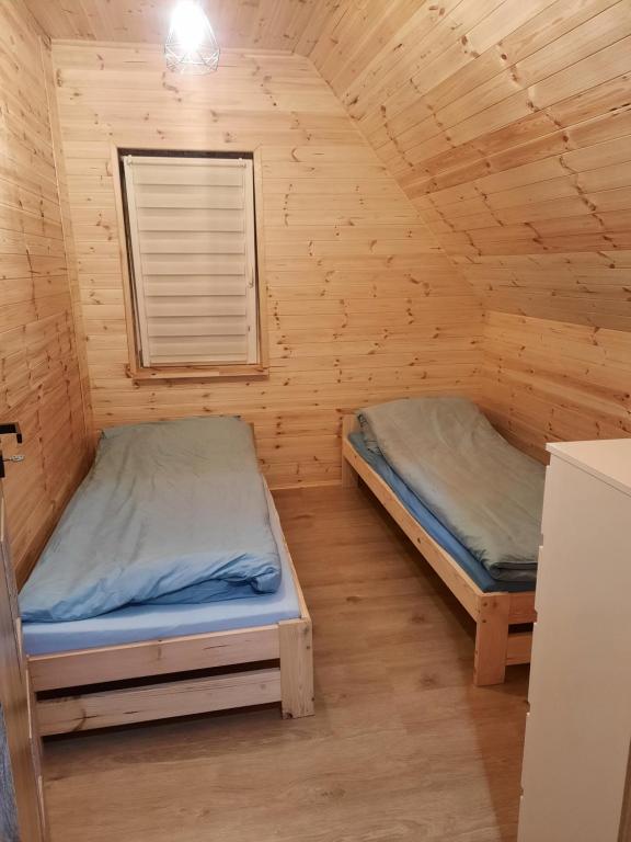Posteľ alebo postele v izbe v ubytovaní Mazurska Sielanka