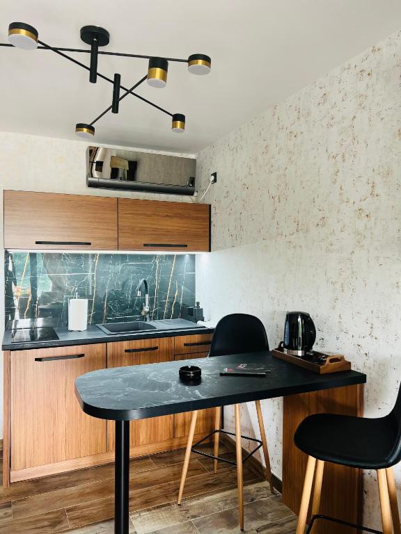 Kuchyň nebo kuchyňský kout v ubytování Apartmani Tiske noći