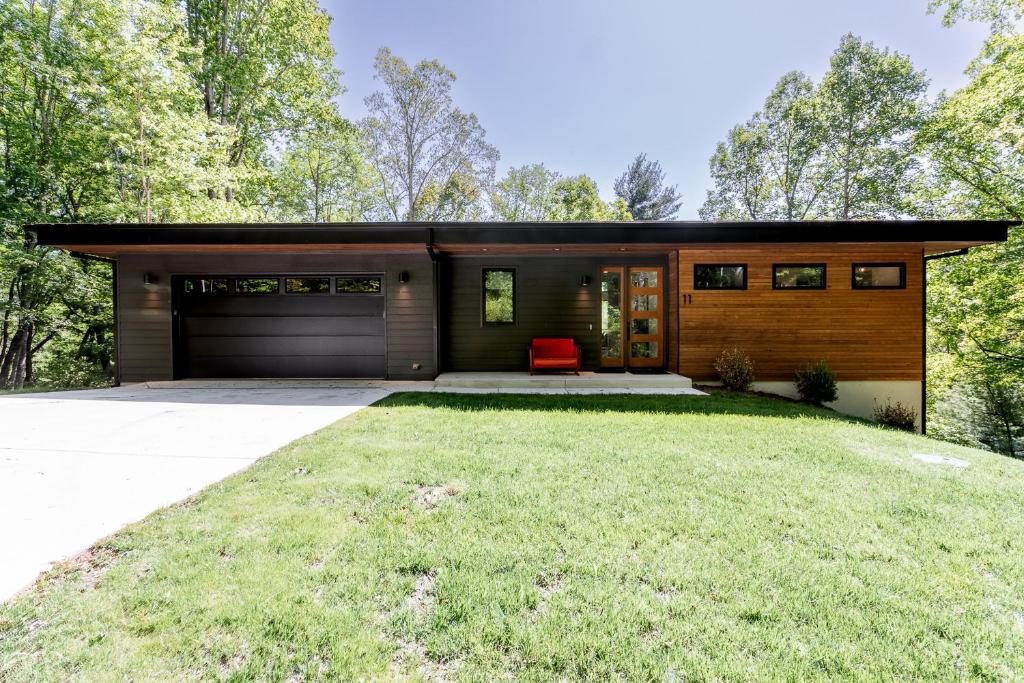 a modern house with a garage at Mountain to Sea Modern in Asheville
