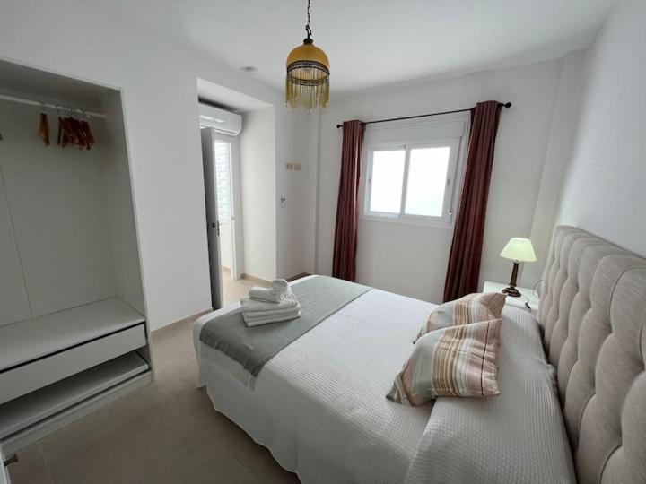 Postel nebo postele na pokoji v ubytování Apartamento La Canela