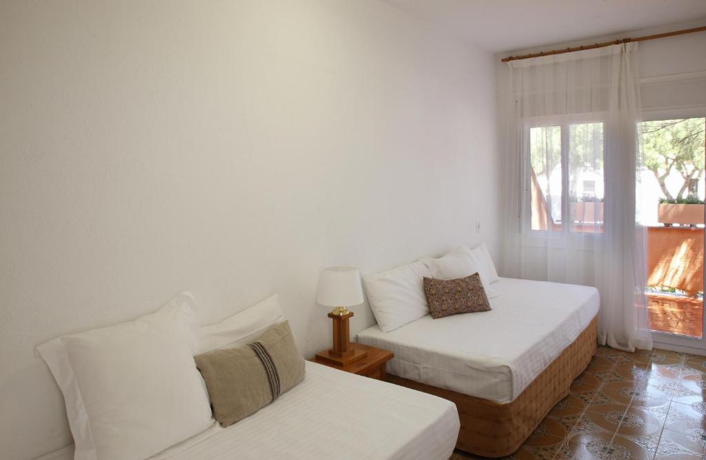 Posteľ alebo postele v izbe v ubytovaní Casa adosada en Pals Playa by Apartaments Golf